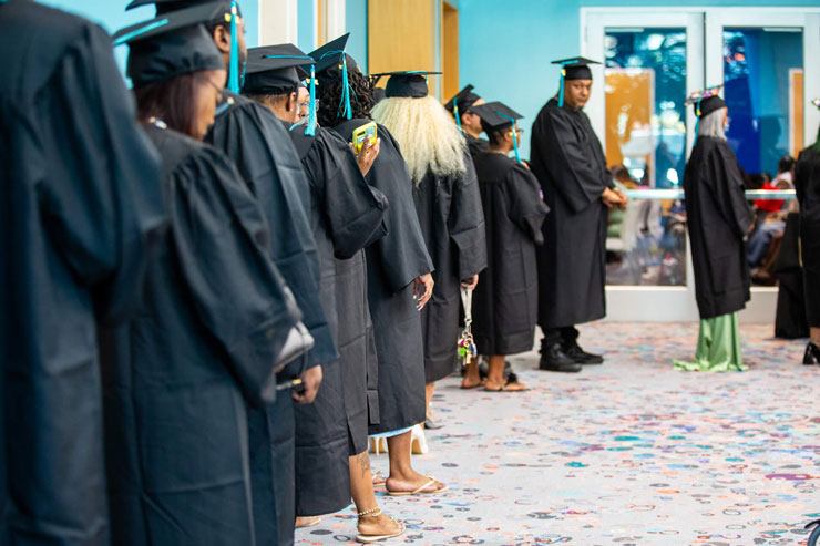 students preparing to walk at graduation