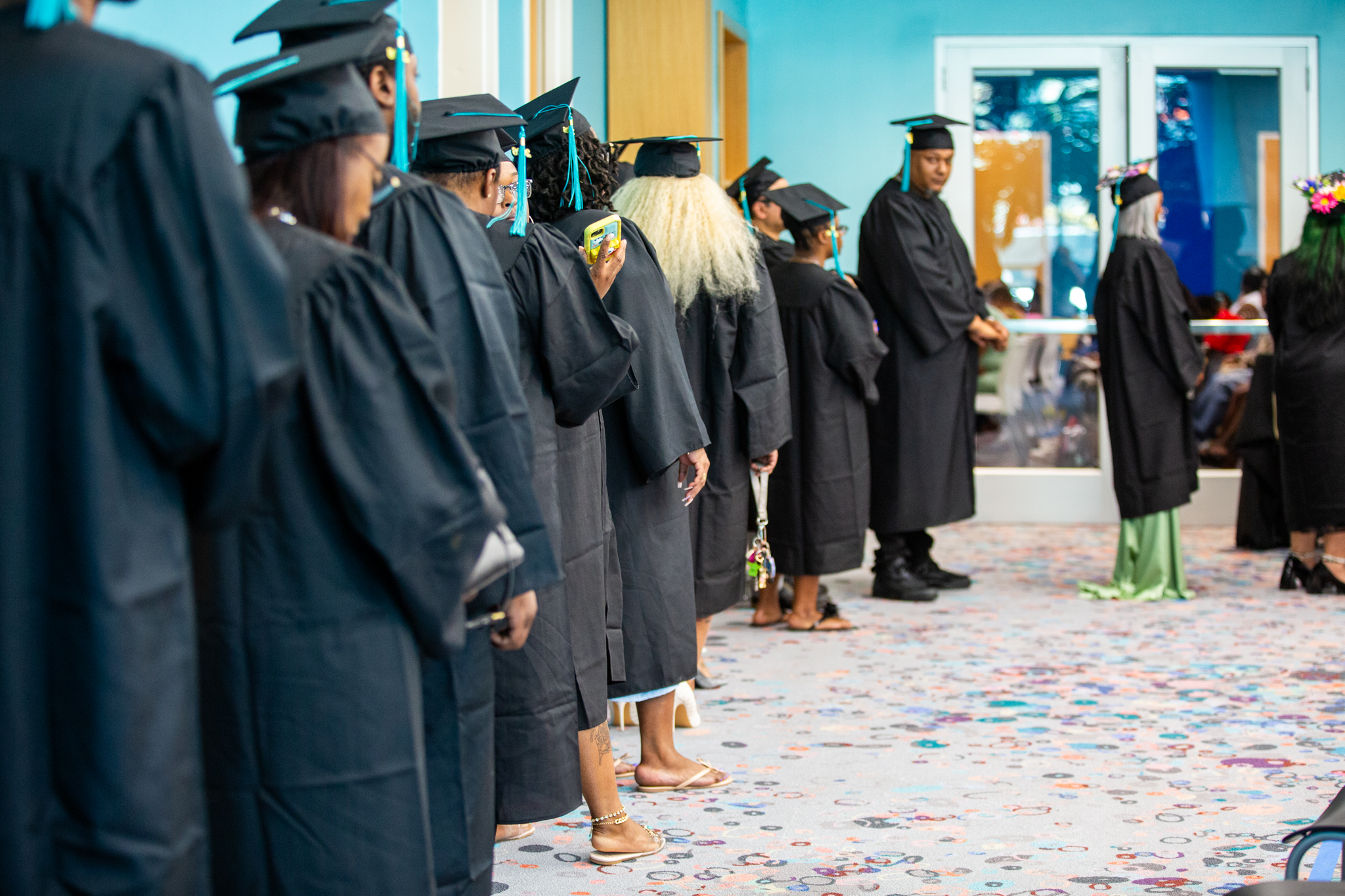 students preparing to walk at graudation