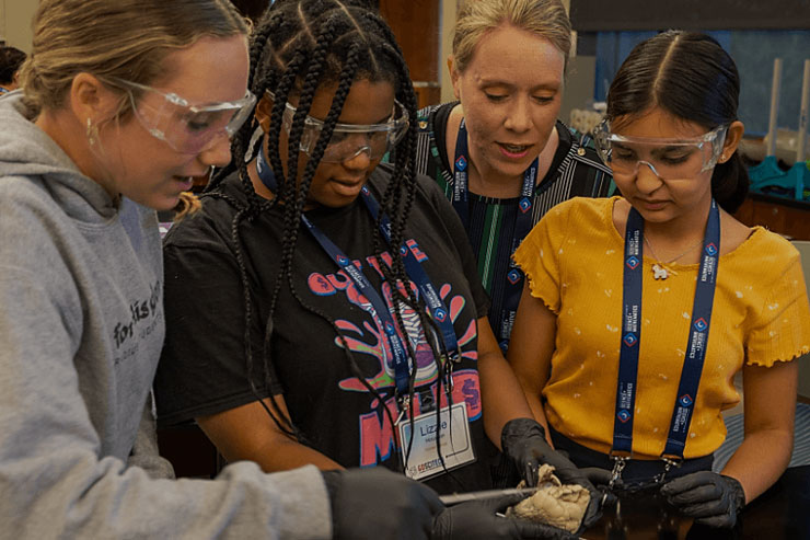 Students working alongside a teacher at the GSSM