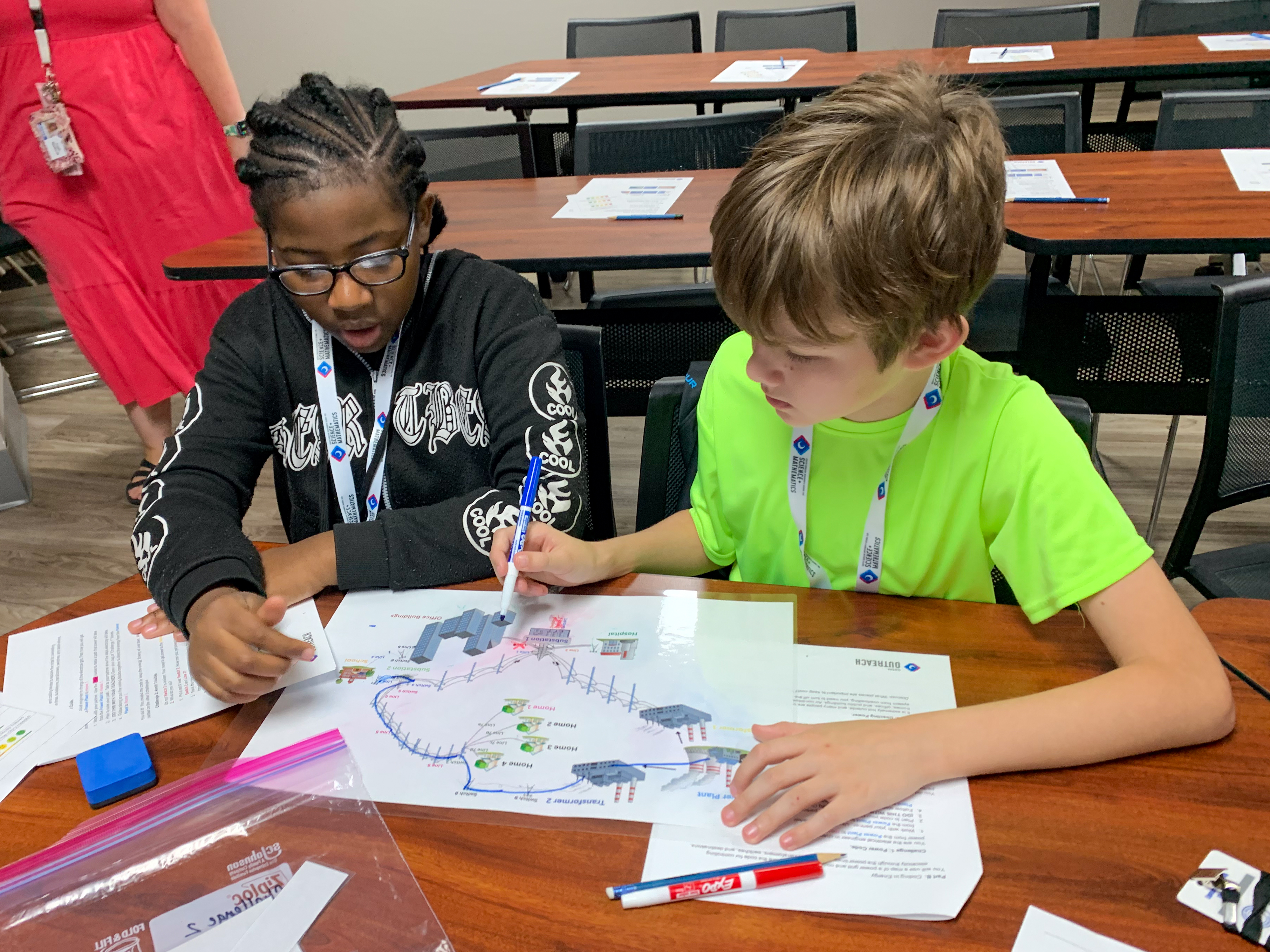 Photo of two young students working at a desk