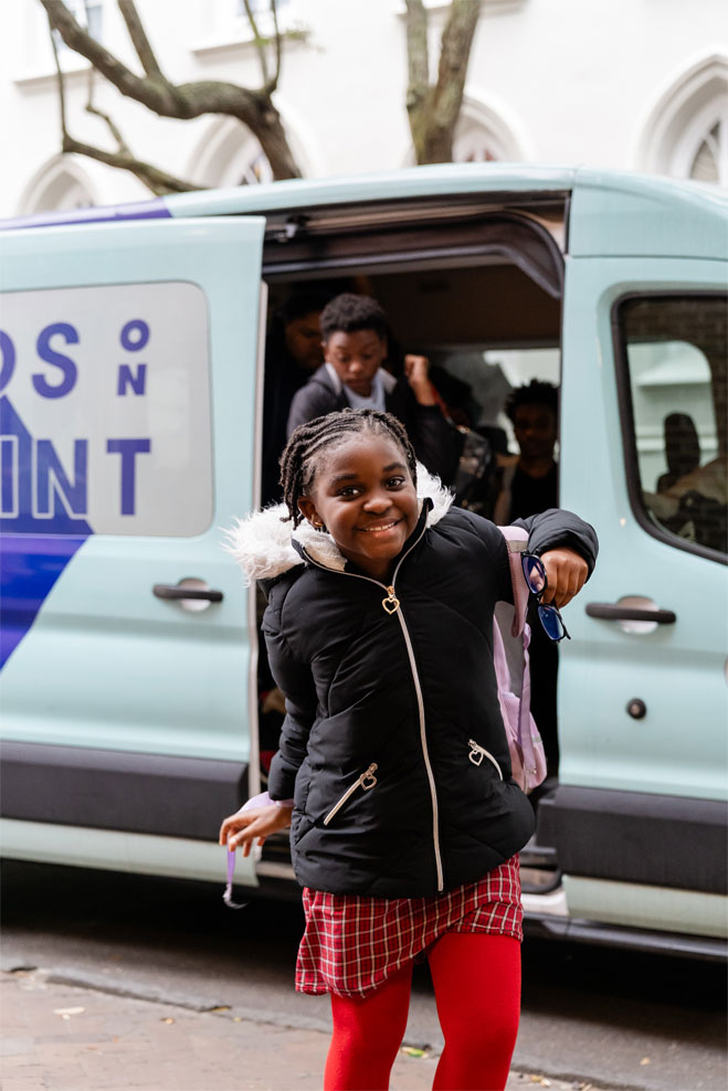 girl exiting a van