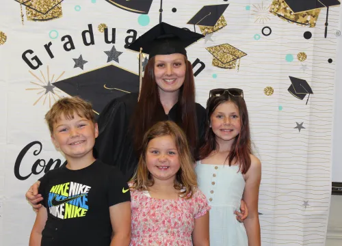 happy graduate with family